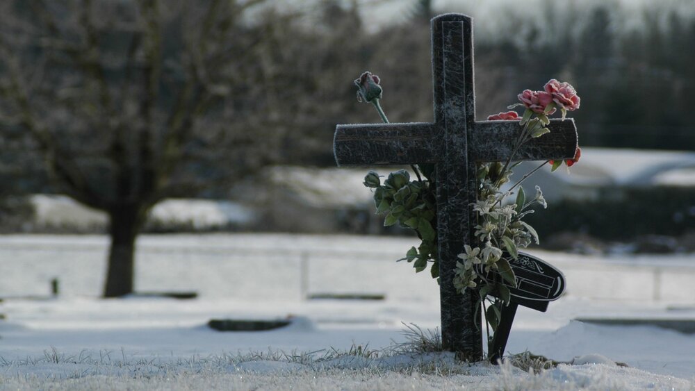 Cross headstone in a cemetery